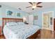 Spacious main bedroom with wood flooring and en-suite bathroom at 2199 El Cerito Ct, Punta Gorda, FL 33950