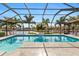 Large screened in saltwater pool with canal view at 2199 El Cerito Ct, Punta Gorda, FL 33950