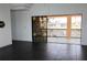 Bright living room with tile flooring and sliding glass doors leading to the outdoor living space at 225 Bangsberg Se Rd, Port Charlotte, FL 33952