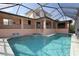 A private pool with built in spa is surrounded by an enclosed lanai for outdoor enjoyment at 225 Bangsberg Se Rd, Port Charlotte, FL 33952