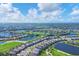 Expansive aerial view of a golf course community near the coast at 25223 Keygrass Ct, Punta Gorda, FL 33955