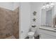 Clean bathroom with shower, toilet and granite vanity at 25223 Keygrass Ct, Punta Gorda, FL 33955