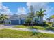 Two-story home with gray siding and two-car garage at 25223 Keygrass Ct, Punta Gorda, FL 33955