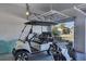 Garage with golf cart, bags and extra storage at 25223 Keygrass Ct, Punta Gorda, FL 33955