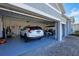 Two-car garage with golf cart and extra storage space at 25223 Keygrass Ct, Punta Gorda, FL 33955