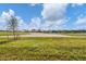 Peaceful view of the golf course from the backyard at 25223 Keygrass Ct, Punta Gorda, FL 33955