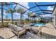 Relaxing pool and patio area with covered lanai, spa, and comfortable seating at 25223 Keygrass Ct, Punta Gorda, FL 33955