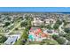 Aerial view of condo community with pool, tennis courts, and ocean at 255 W End Dr # 2412, Punta Gorda, FL 33950