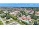 Aerial showing condo community, pool, tennis courts, and water views at 255 W End Dr # 2412, Punta Gorda, FL 33950