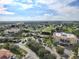 Aerial view of condo community with pool and tennis courts at 255 W End Dr # 2412, Punta Gorda, FL 33950