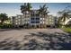 Condo building at dusk with palm trees and parking at 255 W End Dr # 2412, Punta Gorda, FL 33950