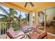 Relaxing lanai with table and chairs, tropical view at 255 W End Dr # 2412, Punta Gorda, FL 33950