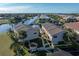 Aerial view of townhome with private walkway, neighboring buildings, and marina at 3335 Purple Martin Dr # 1, Punta Gorda, FL 33950