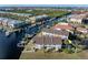 Aerial view showcasing townhome, private dock, and surrounding waterfront community at 3335 Purple Martin Dr # 1, Punta Gorda, FL 33950