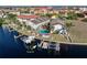 Aerial view of townhome, private pool, dock, and surrounding waterfront community at 3335 Purple Martin Dr # 1, Punta Gorda, FL 33950