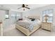 Comfortable bedroom with king bed and built-in shelving at 3335 Purple Martin Dr # 1, Punta Gorda, FL 33950