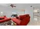 Living room with red couches and tile floors at 3335 Purple Martin Dr # 1, Punta Gorda, FL 33950