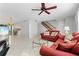 Living room with red couches and stairs at 3335 Purple Martin Dr # 1, Punta Gorda, FL 33950