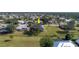 An aerial shot of a house nestled amongst mature trees in a residential neighborhood at 7529 Coral Tree, Punta Gorda, FL 33955
