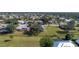Aerial perspective showcasing a home with a pool and a spacious lot in a tranquil neighborhood setting at 7529 Coral Tree, Punta Gorda, FL 33955