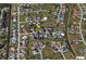 Aerial view of a house situated in a residential neighborhood with surrounding homes at 7529 Coral Tree, Punta Gorda, FL 33955
