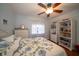 Bedroom with a full-size bed, built in shelving and hardwood floors at 7529 Coral Tree, Punta Gorda, FL 33955