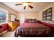 Bedroom with a full-size bed, dresser, and views of the backyard at 7529 Coral Tree, Punta Gorda, FL 33955
