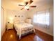 Bedroom with a full-size bed, dresser, and hardwood floors at 7529 Coral Tree, Punta Gorda, FL 33955