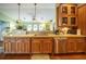 Kitchen features granite countertops, wood cabinets, and a stainless steel sink at 7529 Coral Tree, Punta Gorda, FL 33955