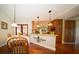 Kitchen nook with wood table and chairs, adjacent to kitchen at 7529 Coral Tree, Punta Gorda, FL 33955