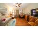 Home office with wood furniture, ceiling fan, and hardwood floors at 7529 Coral Tree, Punta Gorda, FL 33955