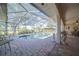Spacious pool area with screened enclosure and patio furniture at 7529 Coral Tree, Punta Gorda, FL 33955