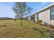 Large backyard with grassy lawn and landscaping at 16031 Alcira Cir, Punta Gorda, FL 33955