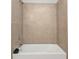Bathroom with a bathtub and beige tile at 16031 Alcira Cir, Punta Gorda, FL 33955