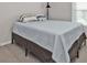 Cozy bedroom with light blue bedding and floor lamp at 16031 Alcira Cir, Punta Gorda, FL 33955