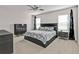 King bedroom with modern dark dresser and nightstands at 16031 Alcira Cir, Punta Gorda, FL 33955