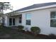 Rear view of house showcasing sliding glass doors and patio at 16031 Alcira Cir, Punta Gorda, FL 33955