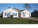 Single-story home with gray siding, blue shutters, and a paved driveway at 16031 Alcira Cir, Punta Gorda, FL 33955