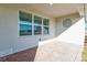 Covered patio with brick flooring and window at 16031 Alcira Cir, Punta Gorda, FL 33955