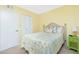 Guest bedroom with coastal bedding and green accent wall at 19505 Quesada Ave # L102, Port Charlotte, FL 33948