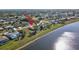 An elevated view shows the property's lake access and neighborhood at 2321 Sofia Ln, Punta Gorda, FL 33983