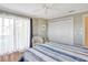 Relaxing bedroom featuring a sliding glass door and closet at 2321 Sofia Ln, Punta Gorda, FL 33983