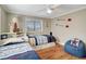 This charming bedroom features two twin beds with built-in storage and wood flooring at 2321 Sofia Ln, Punta Gorda, FL 33983