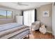 Bedroom features a cozy armchair, light-filled windows and hardwood floors at 2321 Sofia Ln, Punta Gorda, FL 33983
