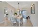 Inviting dining room with a large window and sliding glass door that leads to the outside at 2321 Sofia Ln, Punta Gorda, FL 33983