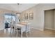 Elegant dining area with a modern chandelier and sliding glass doors with water view at 2321 Sofia Ln, Punta Gorda, FL 33983