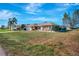 Charming home featuring a manicured lawn, stone accents, and a neatly paved driveway at 2321 Sofia Ln, Punta Gorda, FL 33983