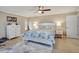 Bright main bedroom with large windows, ceiling fan, and neutral color palette at 2321 Sofia Ln, Punta Gorda, FL 33983