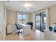 Bright home office featuring water views, modern décor, and sliding glass door to patio at 2321 Sofia Ln, Punta Gorda, FL 33983