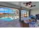 Enclosed patio with a stunning view of the pool and waterfront at 2321 Sofia Ln, Punta Gorda, FL 33983